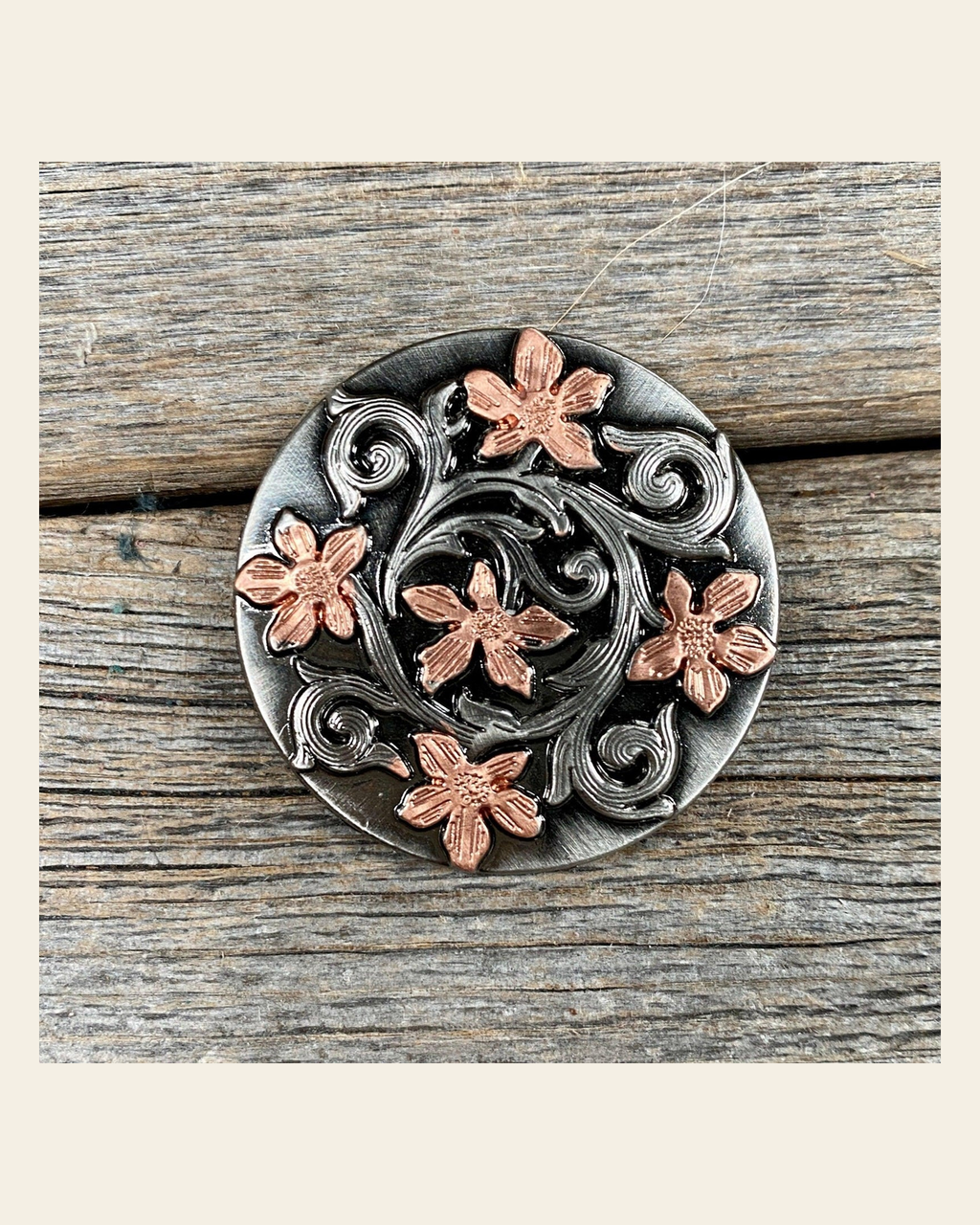 Silver - Copper Floral 1.5"Concho W200L on a warm cream background