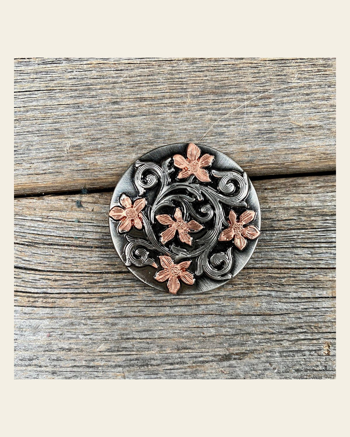 Silver - Copper Floral 1" Concho W200S on a warm cream background