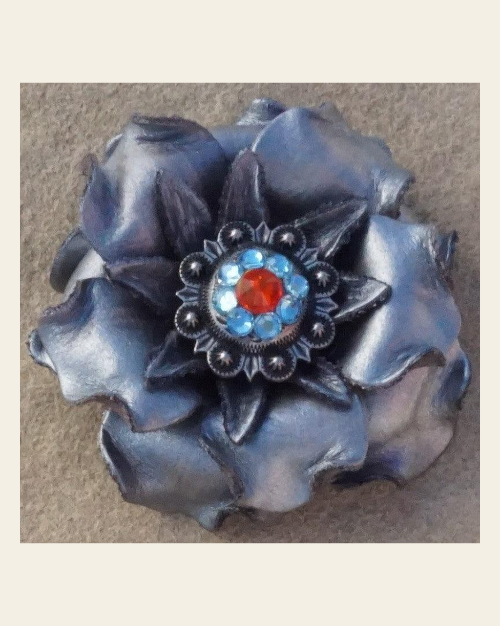 Silver Gardenia Flower With Antique Silver Fire Opal and Aqua 1" Concho on a warm cream background