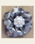 Silver Gardenia Flower With Bright Silver AB 1" Concho on a warm cream background