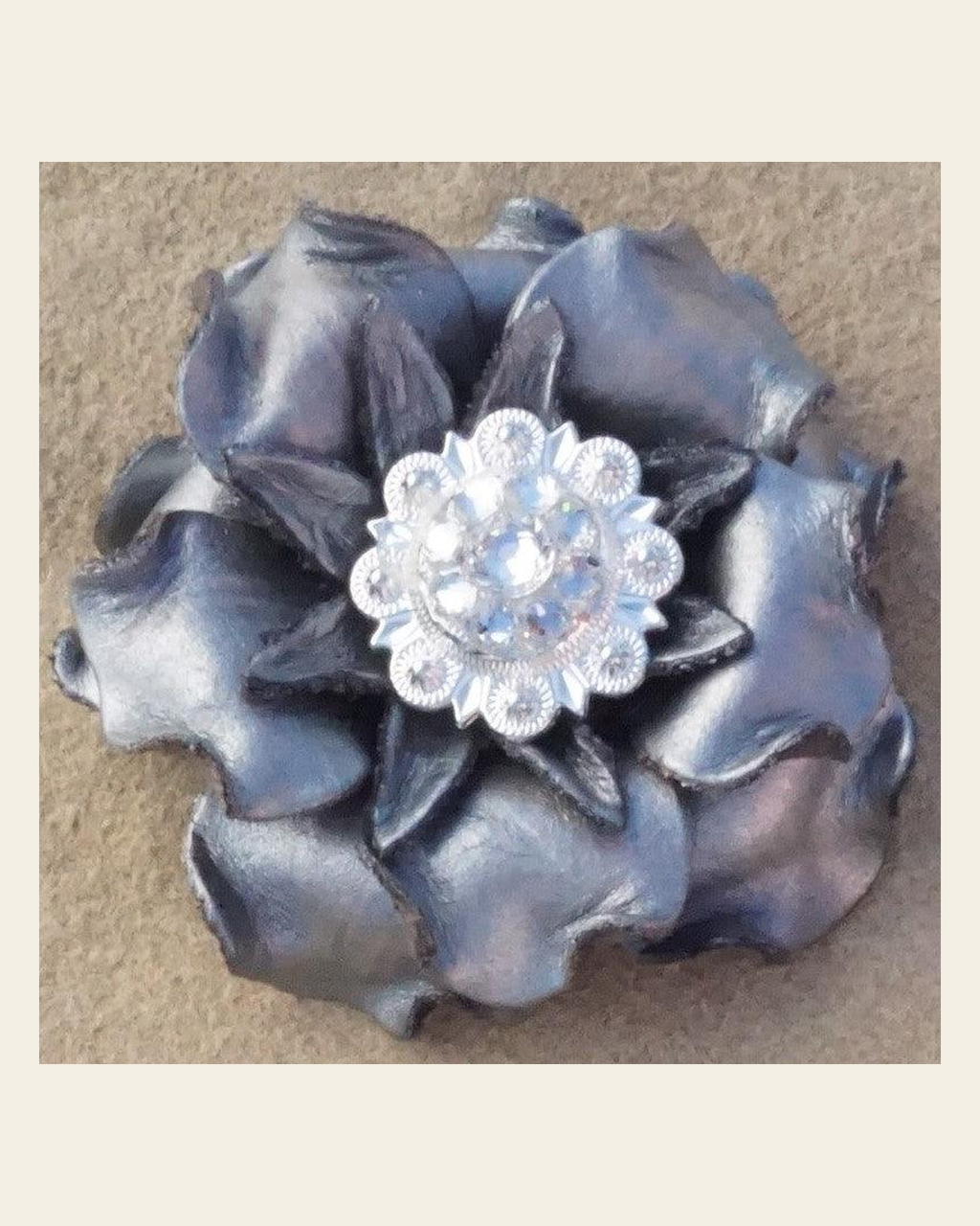 Silver Gardenia Flower With Bright Silver Clear 1" Concho on a warm cream background