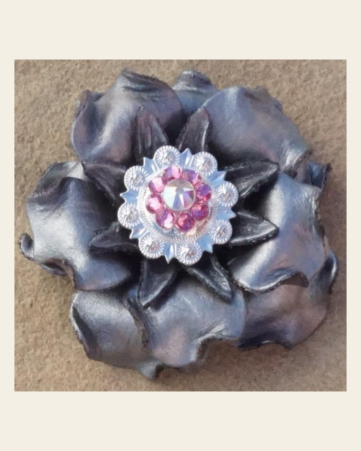 Silver Gardenia Flower With Bright Silver Pink and AB 1" Concho on a warm cream background