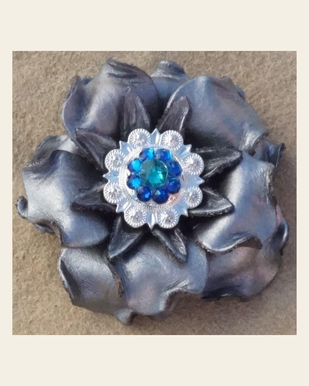Silver Gardenia Flower With Bright Silver Teal and Capri 1" Concho on a warm cream background