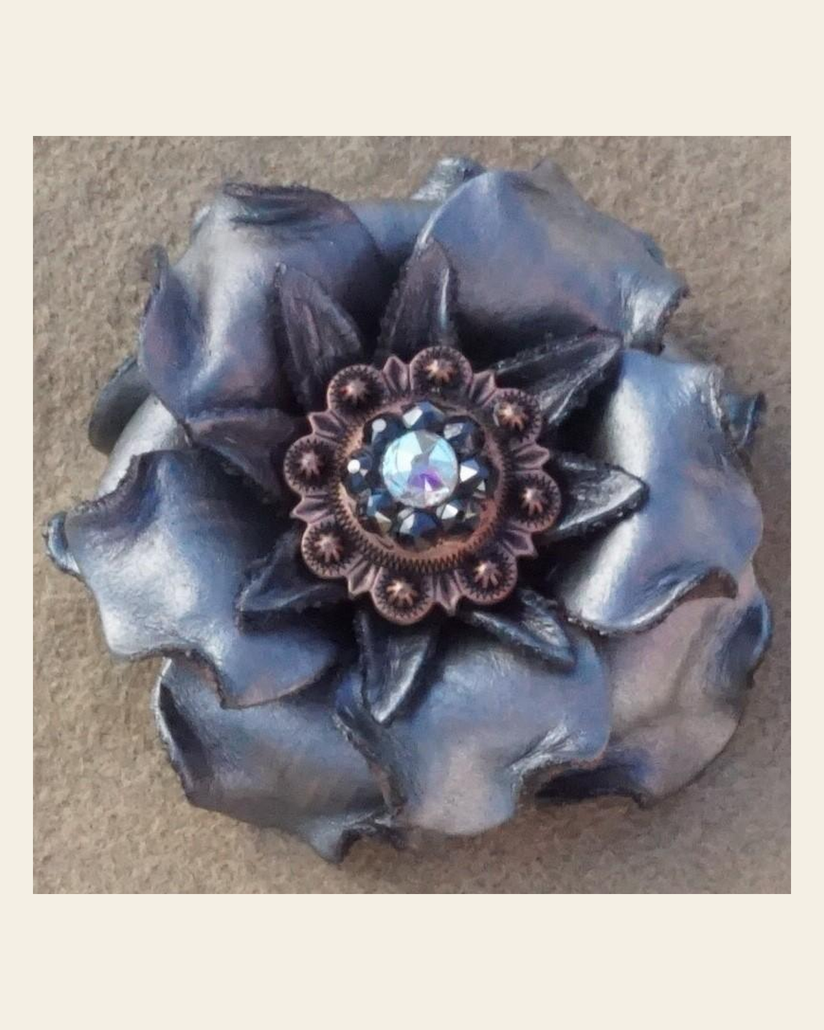 Silver Gardenia Flower With Copper Jet & AB 1" Concho on a warm cream background