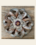 Silver Lotus Flower With Bright Silver Amethyst & AB 1" Concho on a warm cream background