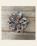Silver Lotus Leather Flower on a warm cream background