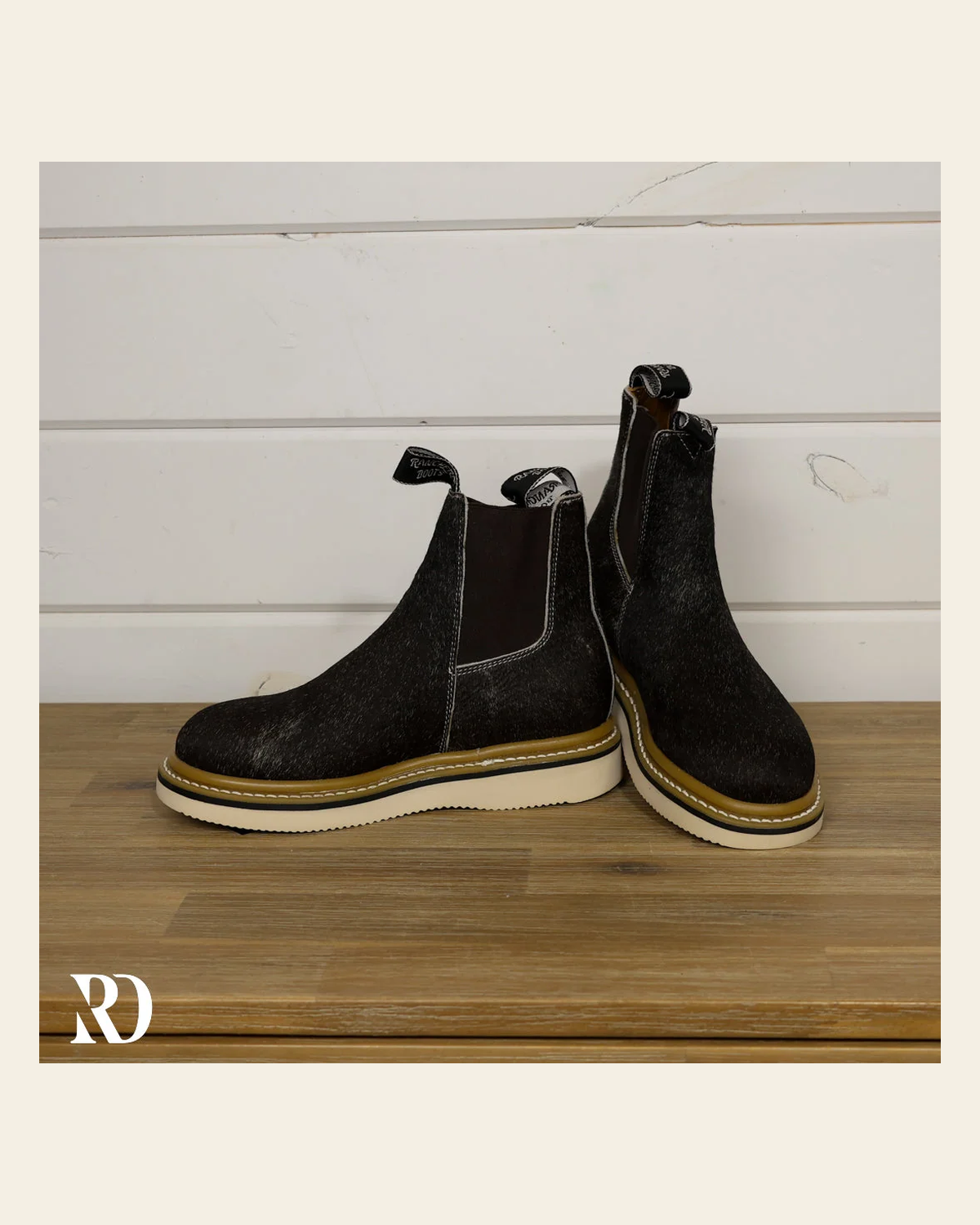 Size 6.5 (style #261) | Hair On Hide Lechera Boot on a warm cream background
