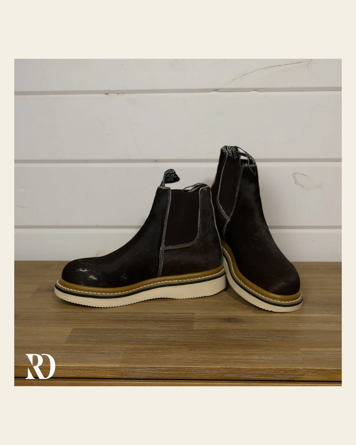 Size 7.5 (style #286) | Hair On Hide Lechera Boot on a warm cream background