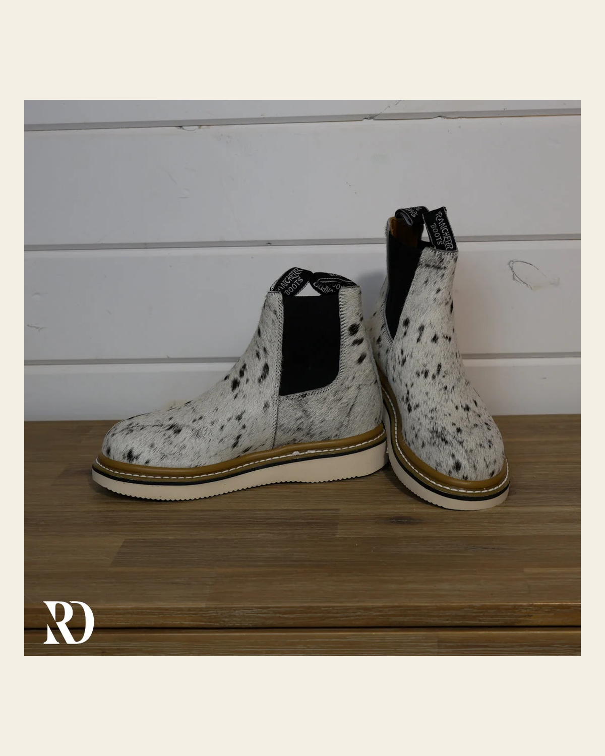 Size 7 (style #177) | Hair On Hide Lechera Boot on a warm cream background