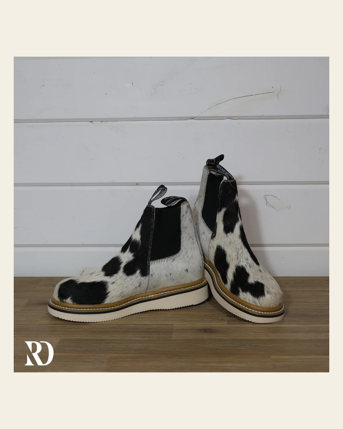 Size 8 (style #395) | Hair On Hide Lechera Boot on a warm cream background