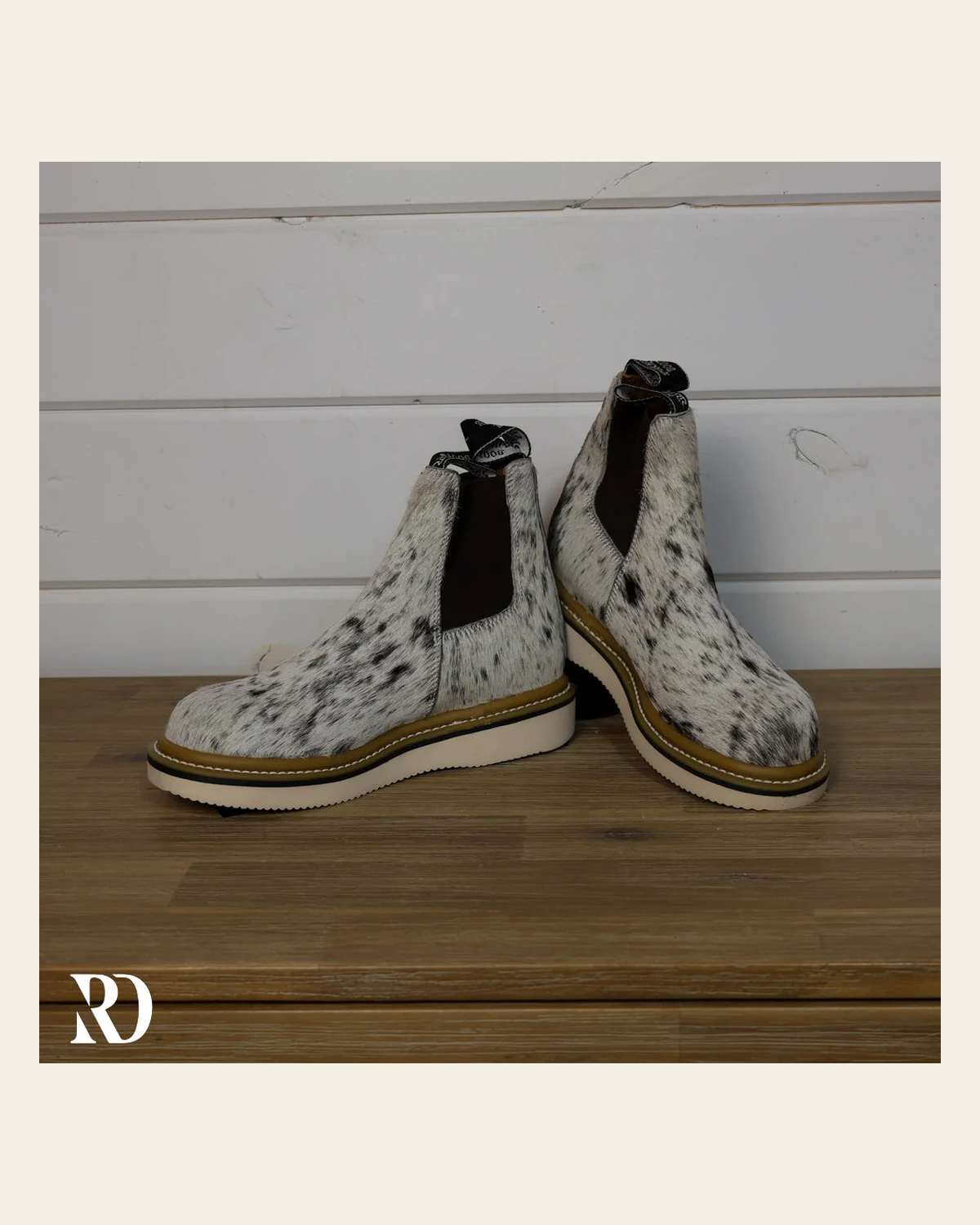 Size 6.5 (style #108) | Hair On Hide Lechera Boot on a warm cream background