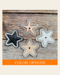Small Star Rhinestone Rosette on a warm cream background