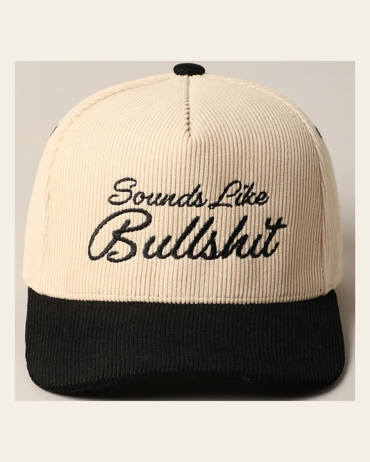 Sounds Like Bullshit Corduroy Trucker | Cap on a warm cream background