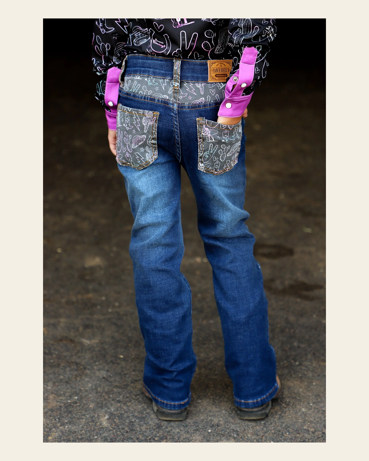*youth* Space Cowboy Bootcut Denim Jeans on a warm cream background
