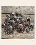 Starburst Antique Silver Western Concho W185 on a warm cream background