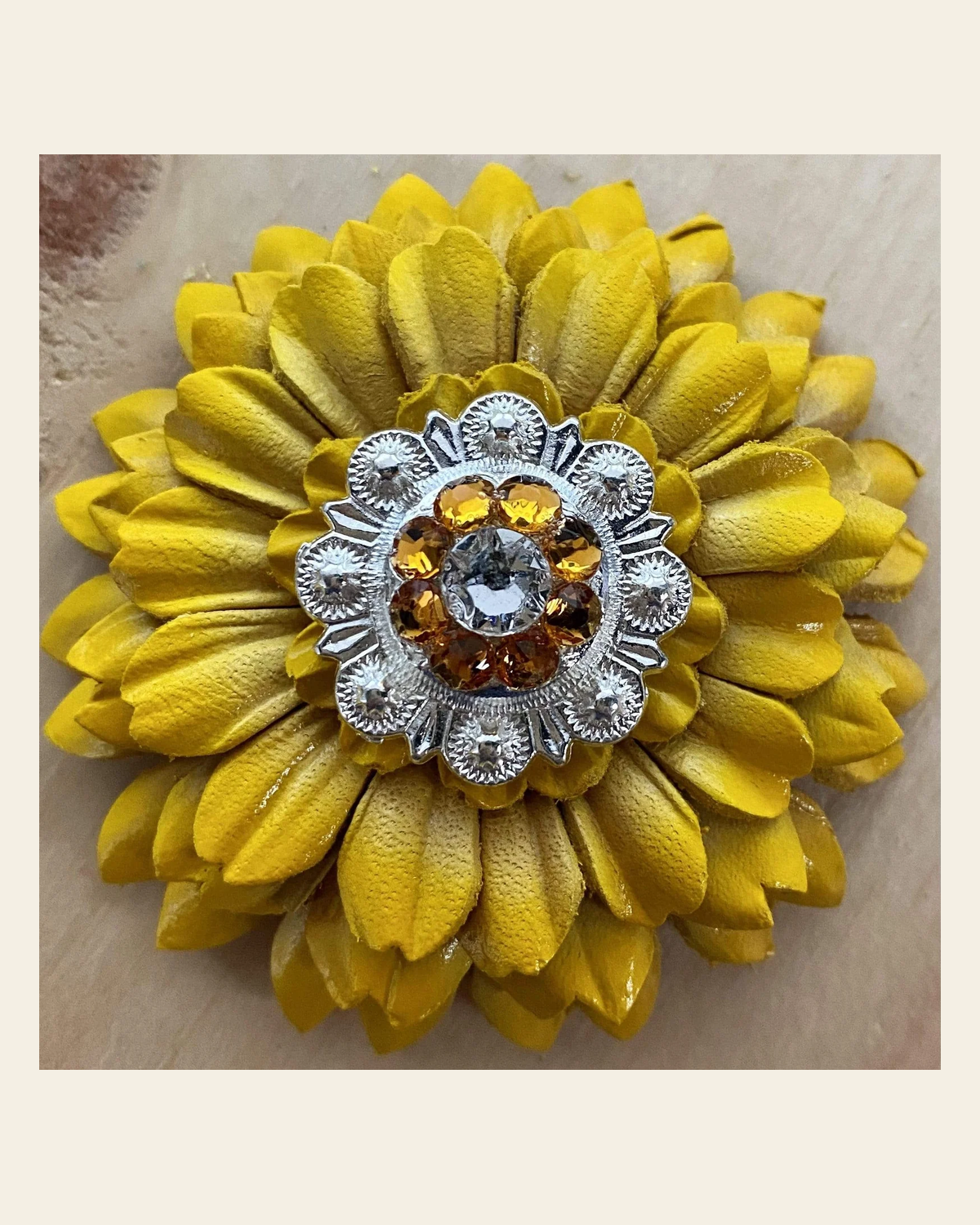Sunflower With Bright Silver Golden & Clear 1" Concho on a warm cream background