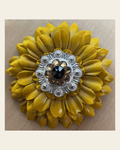 Sunflower with Bright Silver Jet & Champagne 1" Concho on a warm cream background