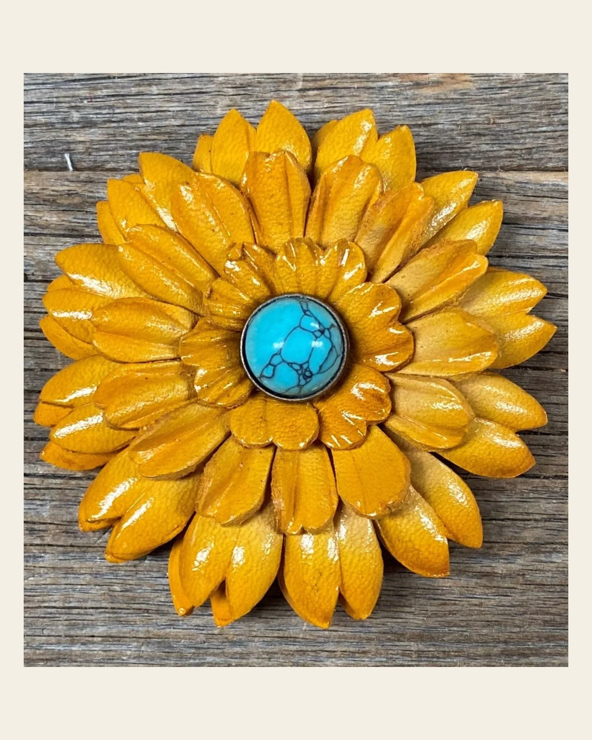 Sunflower With Round Turquoise Cabochon on a warm cream background