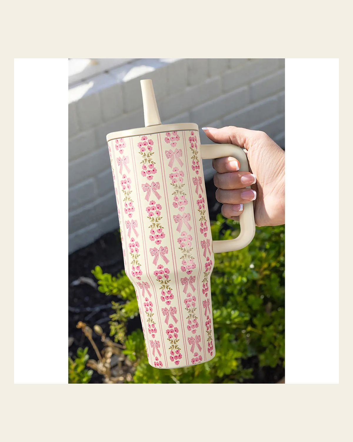Sweet Bow 40 Oz Tumbler on a warm cream background