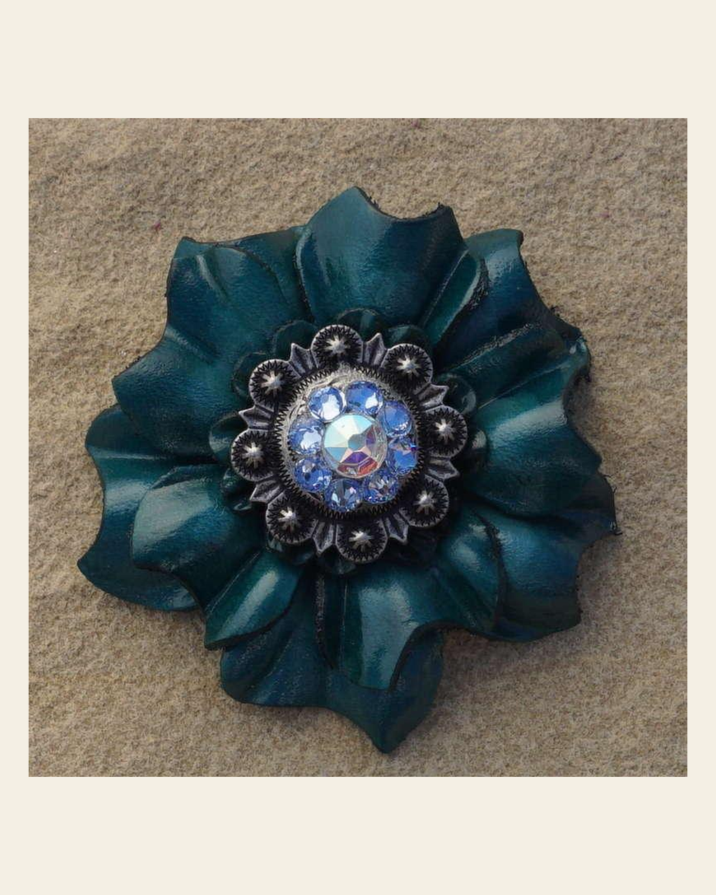 Teal Carnation Flower With Antique Silver Light Sapphire and AB 1" Concho on a warm cream background