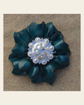 Teal Carnation Flower With Bright Silver Clear 1" Concho on a warm cream background