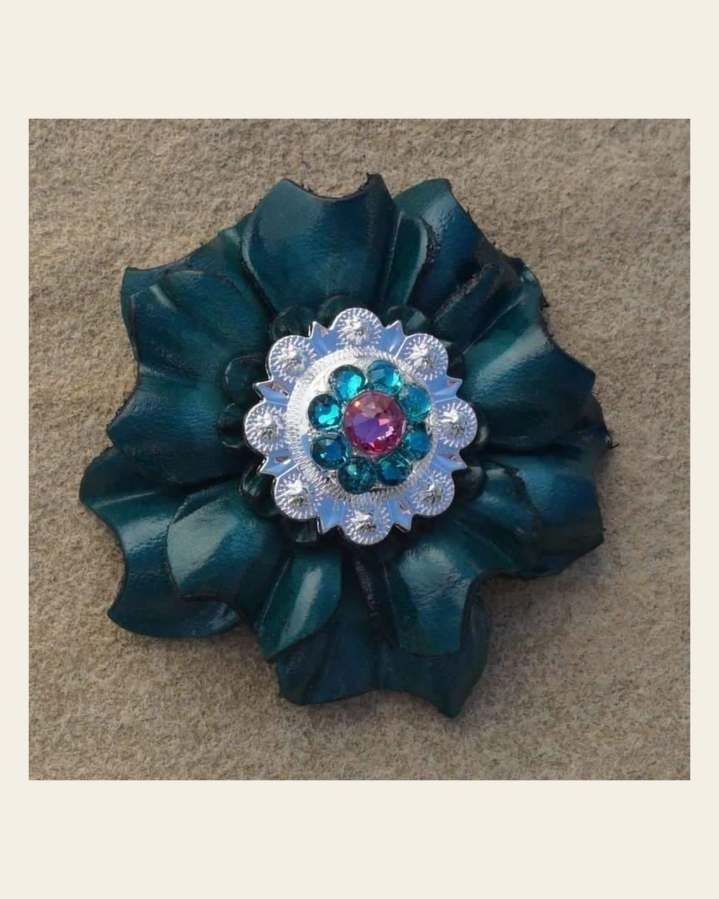 Teal Carnation Flower With Bright Silver Pink & Teal 1" Concho on a warm cream background