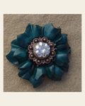Teal Carnation Flower With Copper Clear 1" Concho on a warm cream background