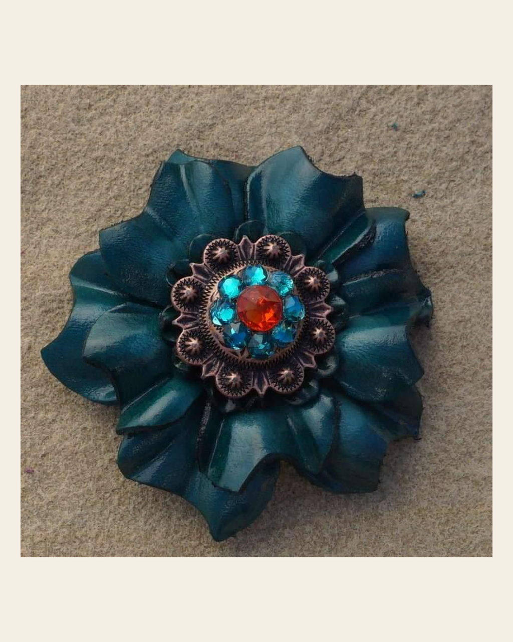 Teal Carnation Flower With Copper Fire Opal & Teal 1" Concho on a warm cream background