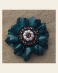Teal Carnation Flower With Copper Topaz & Pearl 1" Concho on a warm cream background
