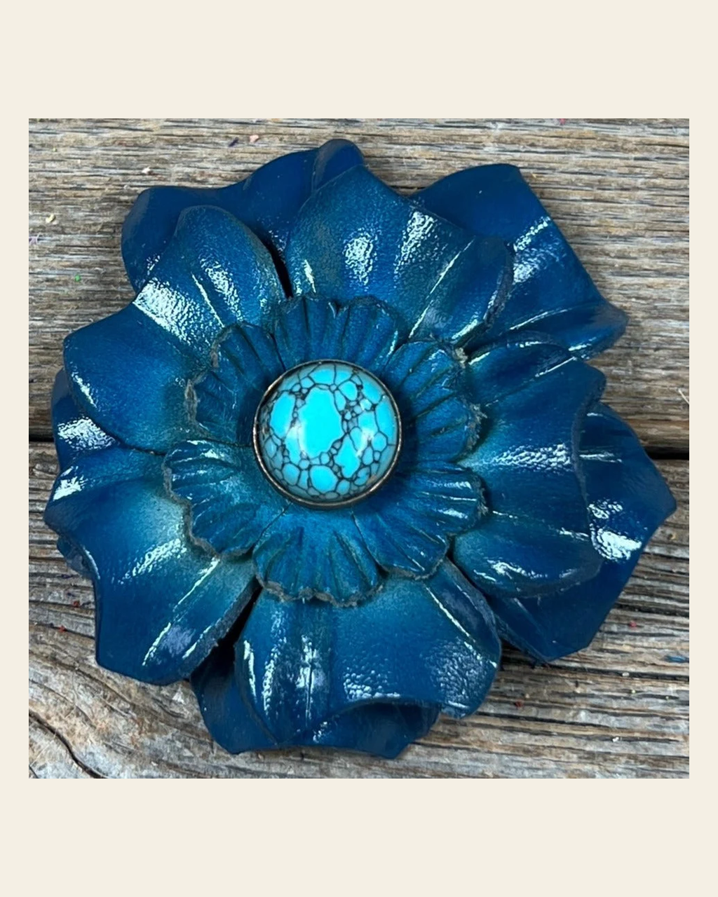 Teal Carnation Flower With Round Turquoise Cabochon on a warm cream background
