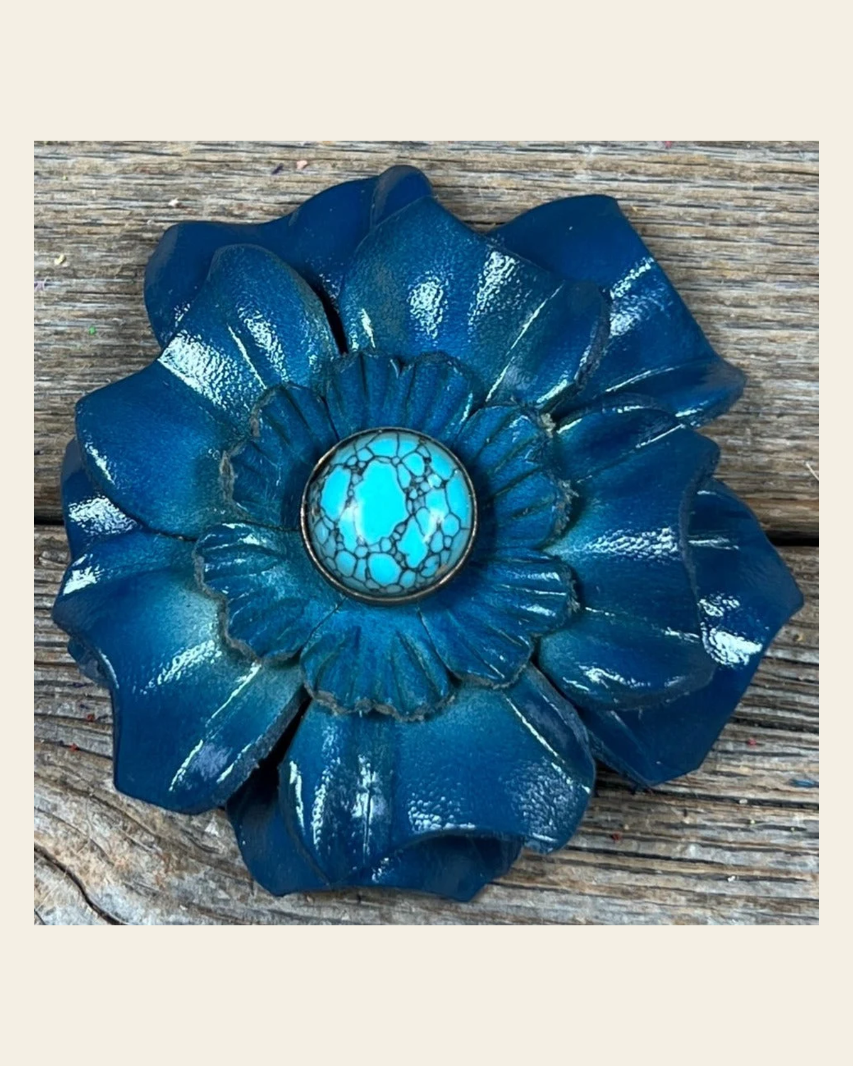 Teal Carnation Flower With Round Turquoise Cabochon on a warm cream background