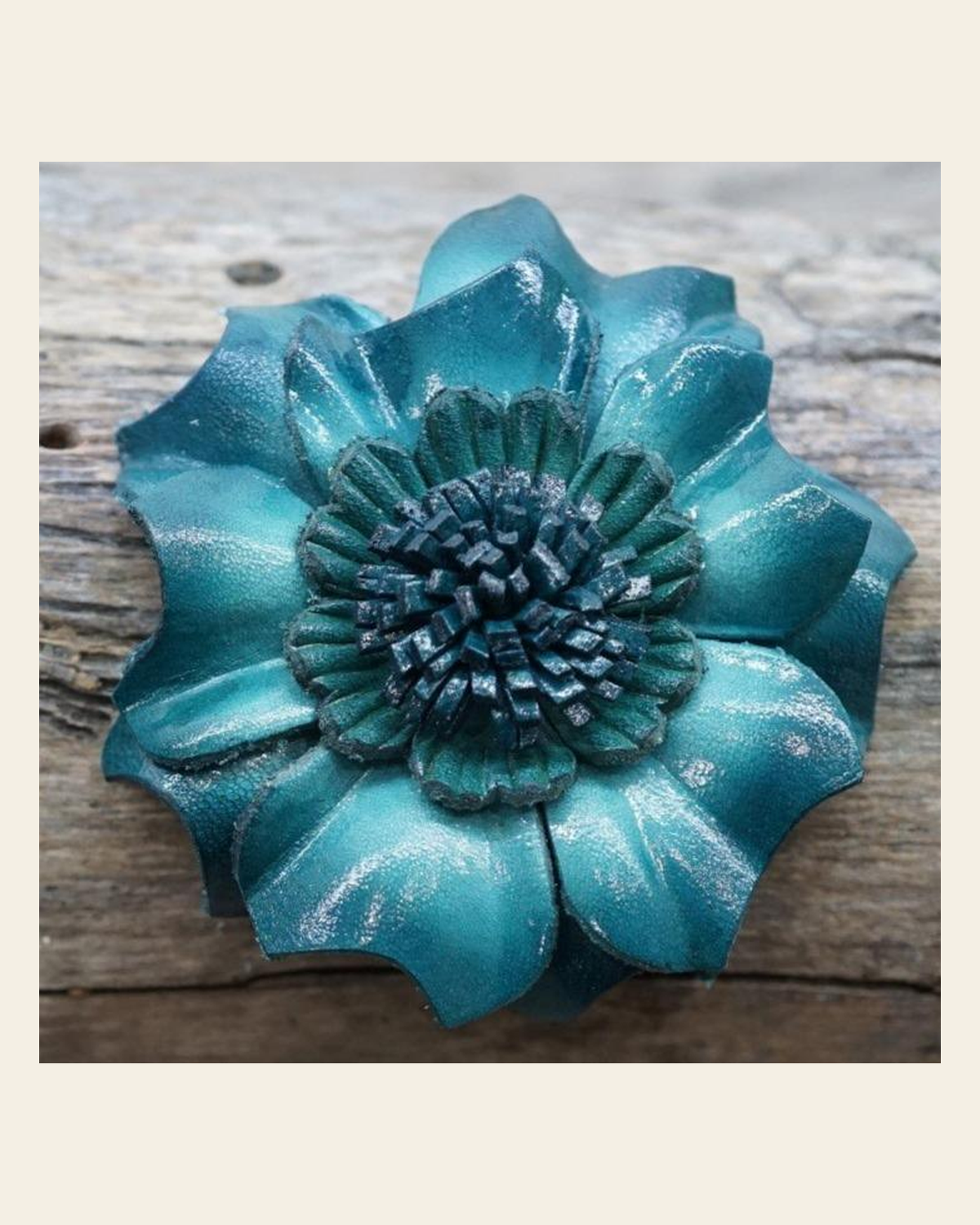 Teal Carnation Leather Flower on a warm cream background