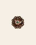 Teal Champagne & Topaz Copper 1.25" European Crystal Concho on a warm cream background
