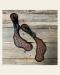 Teal Dot Diamond Tooled Spur Straps on a warm cream background