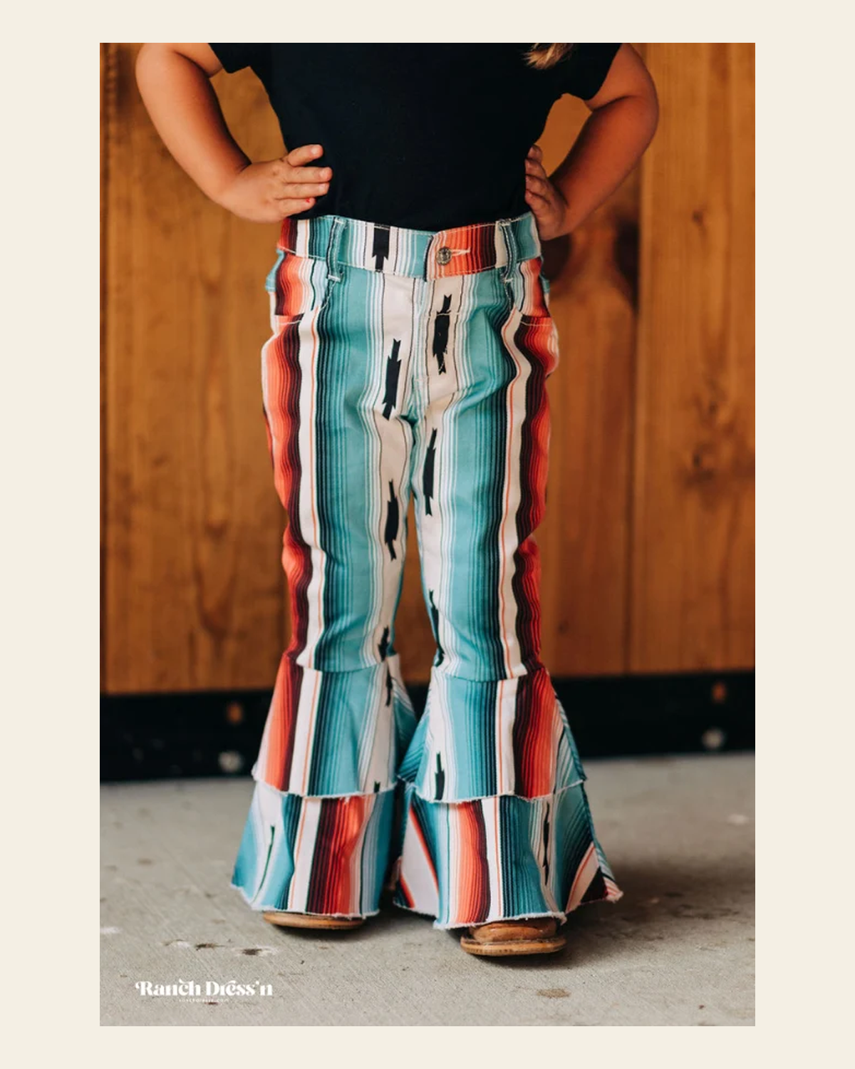 Teal Serape Ruffle Bells on a warm cream background