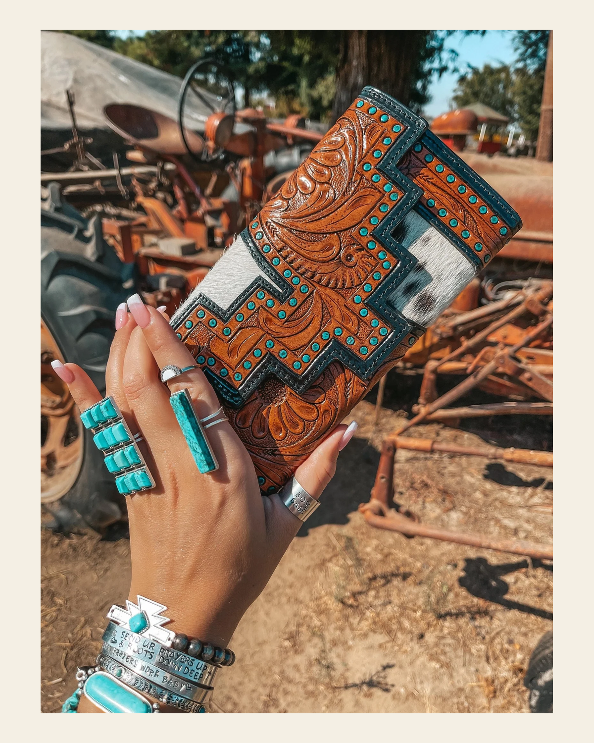 The Darlene Cowhide Leather Tooled | Wallet on a warm cream background