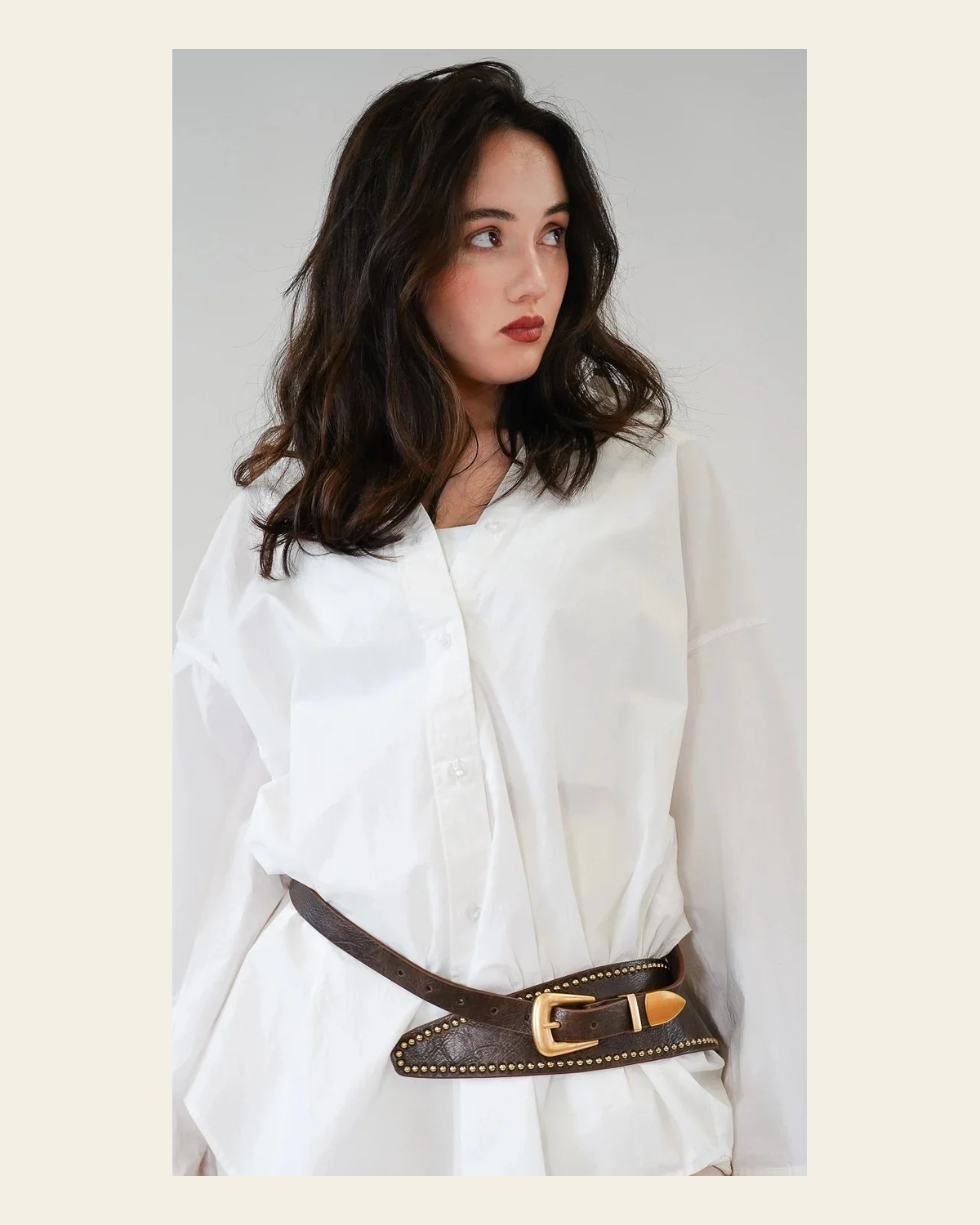 The Western Edit Studded | Belt on a warm cream background