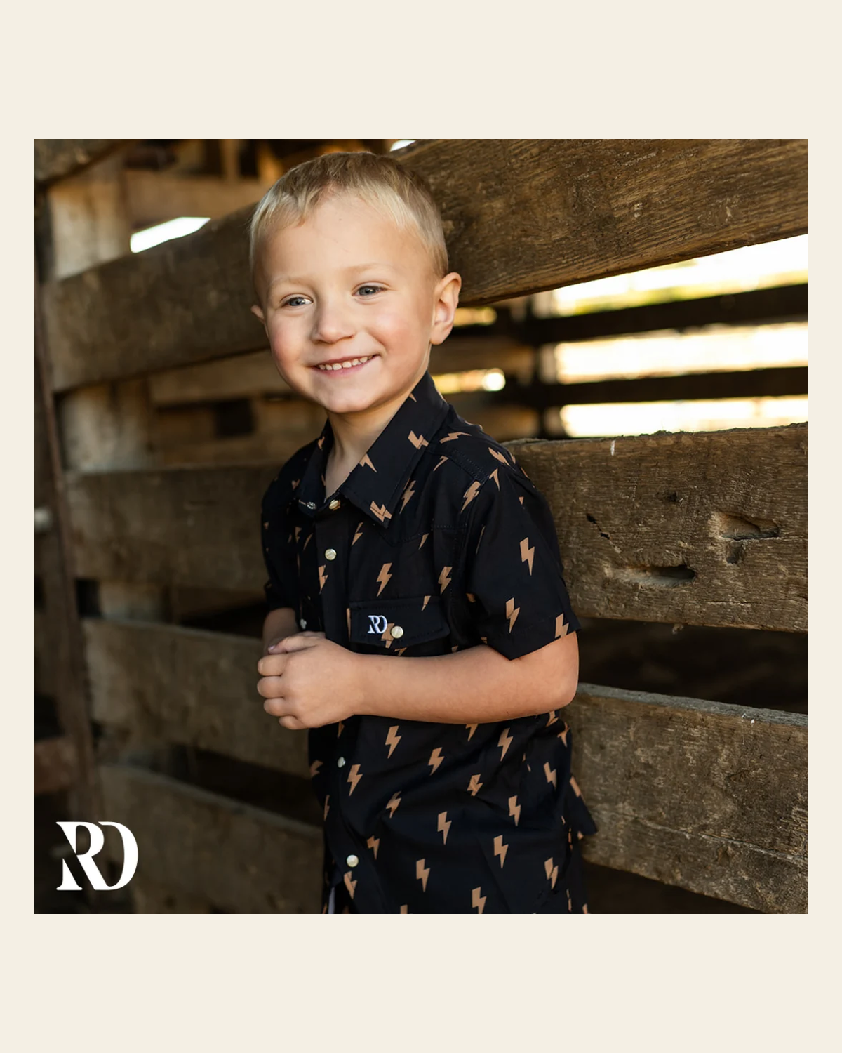 Toddler Button Down | Thunder Bolt on a warm cream background