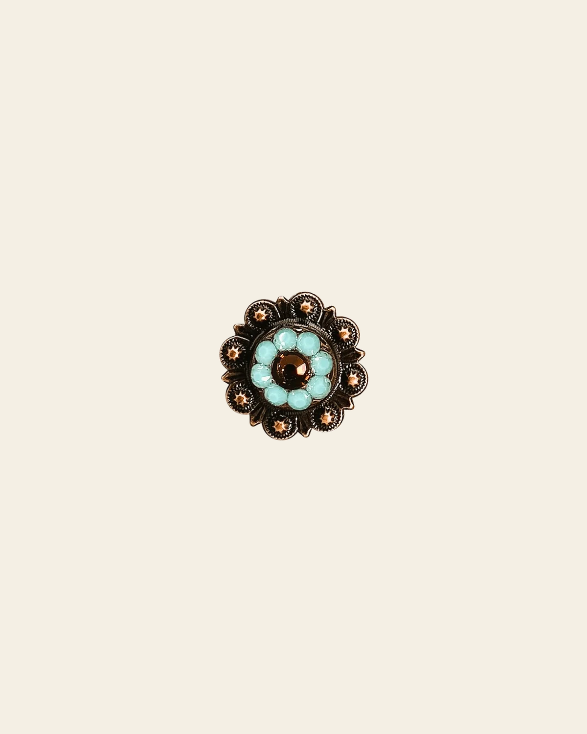 Topaz & Turquoise Copper 1" European Crystal Concho on a warm cream background