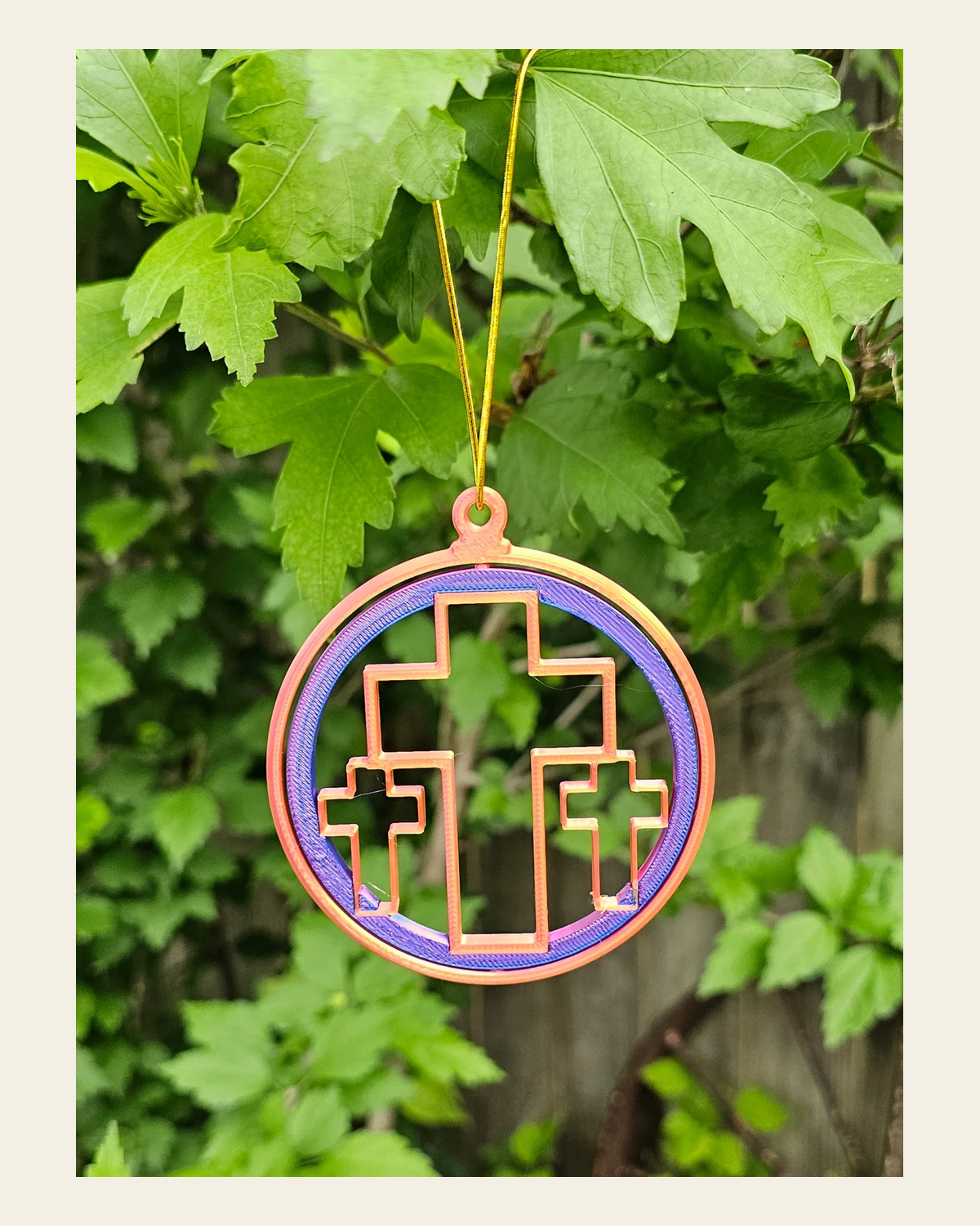 Triple Cross Ornament Medium on a warm cream background