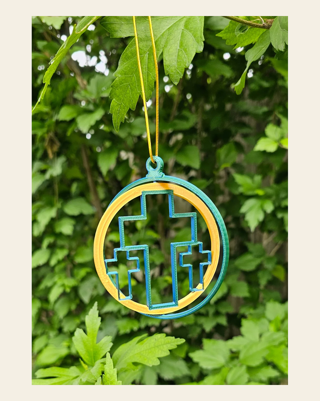 Triple Cross Ornament medium on a warm cream background