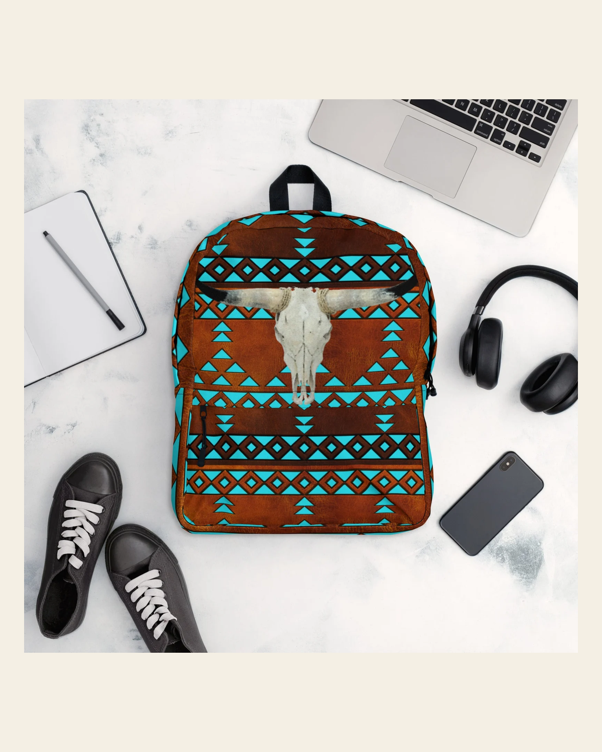 Turquoise Aztec Bull Skull Backpack on a warm cream background
