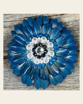 Turquoise Daisy Flower With Bright Silver Jet, Clear 1" Concho on a warm cream background