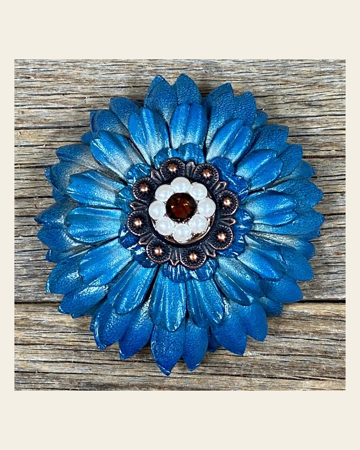 Turquoise Daisy Flower With Copper Topaz & Pearl 1" Concho on a warm cream background