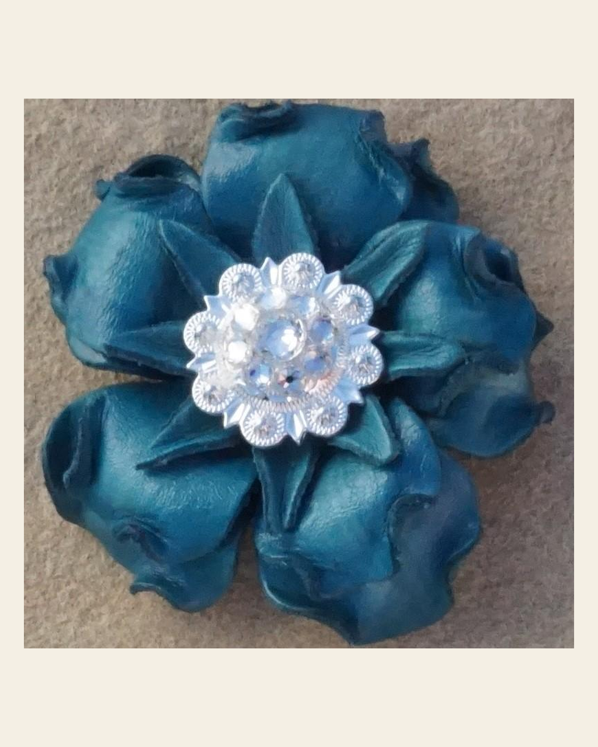 Turquoise Gardenia Flower With Bright Silver Clear 1" Concho on a warm cream background