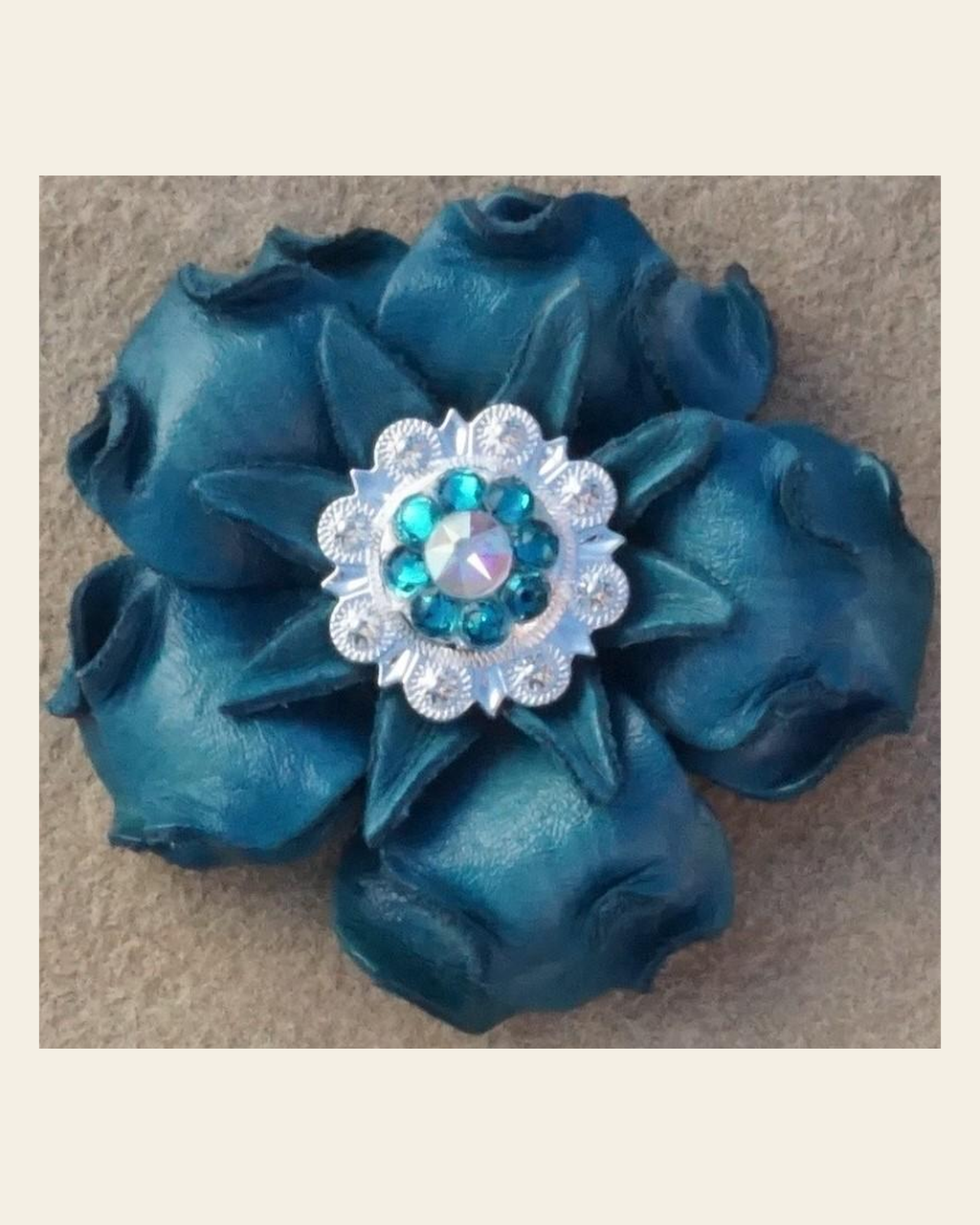 Turquoise Gardenia Flower With Bright Silver Teal & AB 1" Concho on a warm cream background