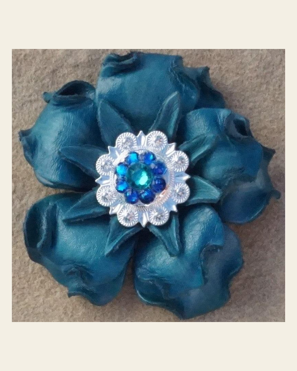 Turquoise Gardenia Flower With Bright Silver Teal and Capri 1" Concho on a warm cream background