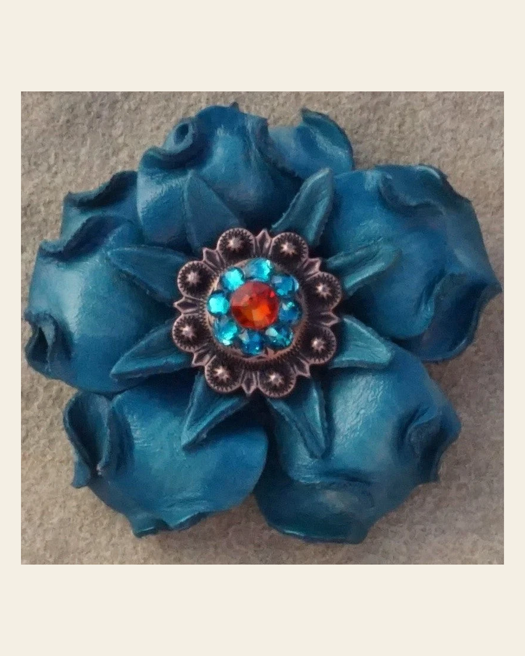 Turquoise Gardenia Flower With Copper Fire Opal & Teal 1" Concho on a warm cream background