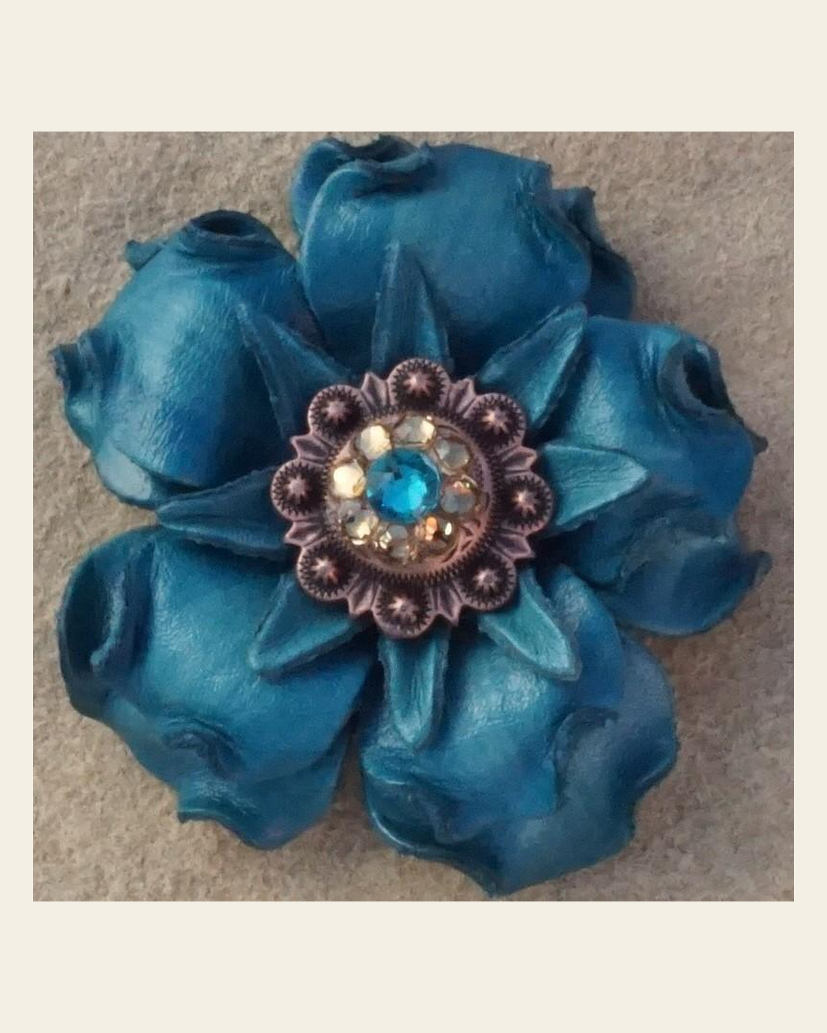 Turquoise Gardenia Flower With Copper Teal & Champagne 1" Concho on a warm cream background