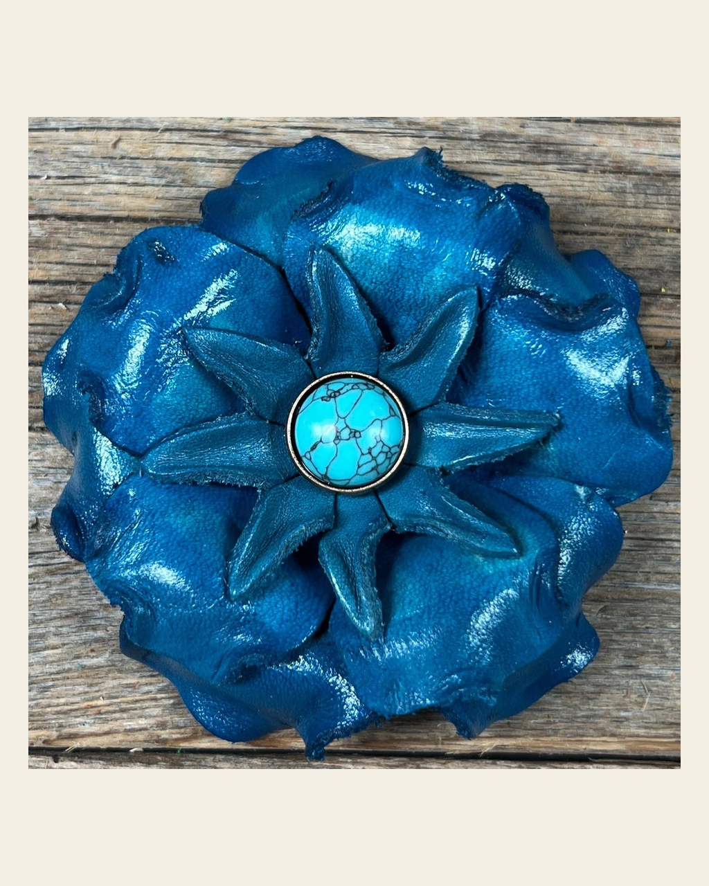 Turquoise Gardenia Flower With Round Turquoise Cabochon on a warm cream background